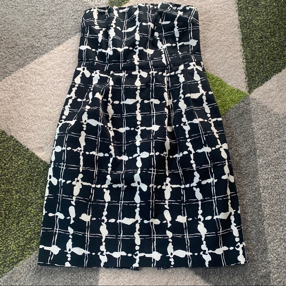 Strapless “ink spot” midi dress